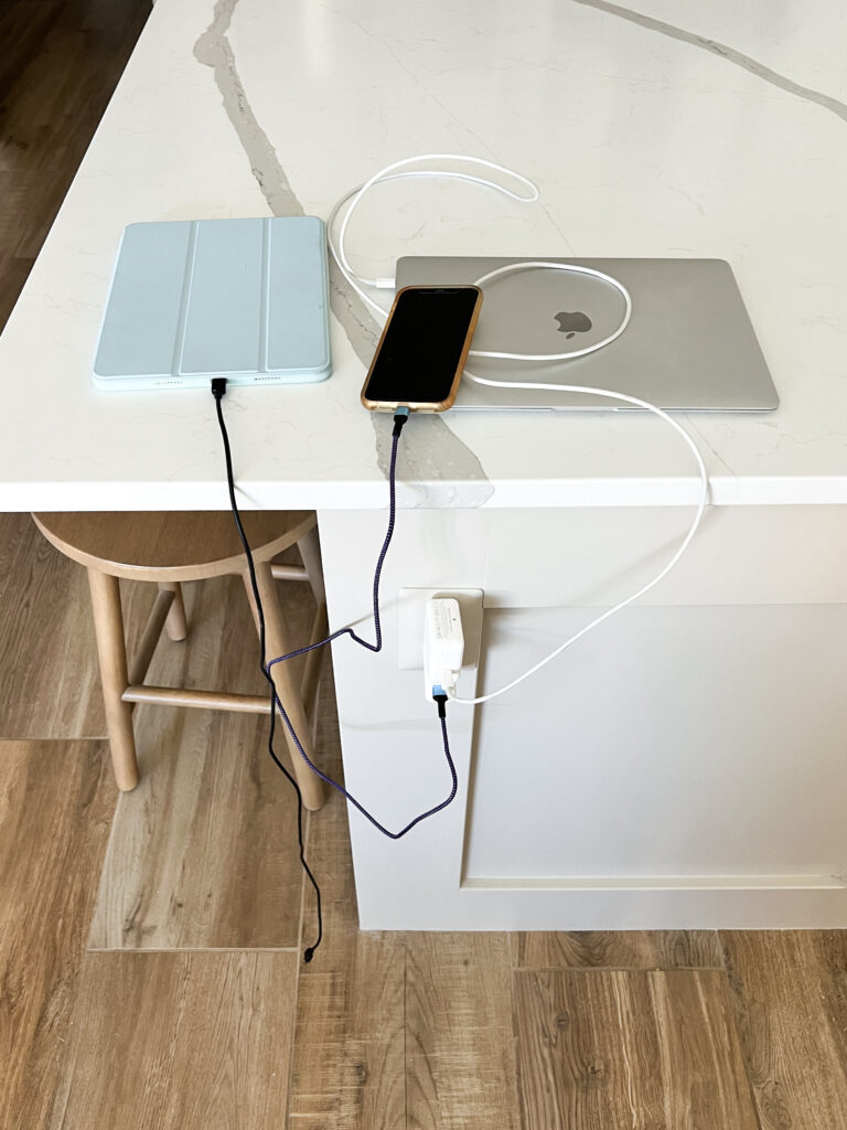 cords and technology devices clutter up a countertop